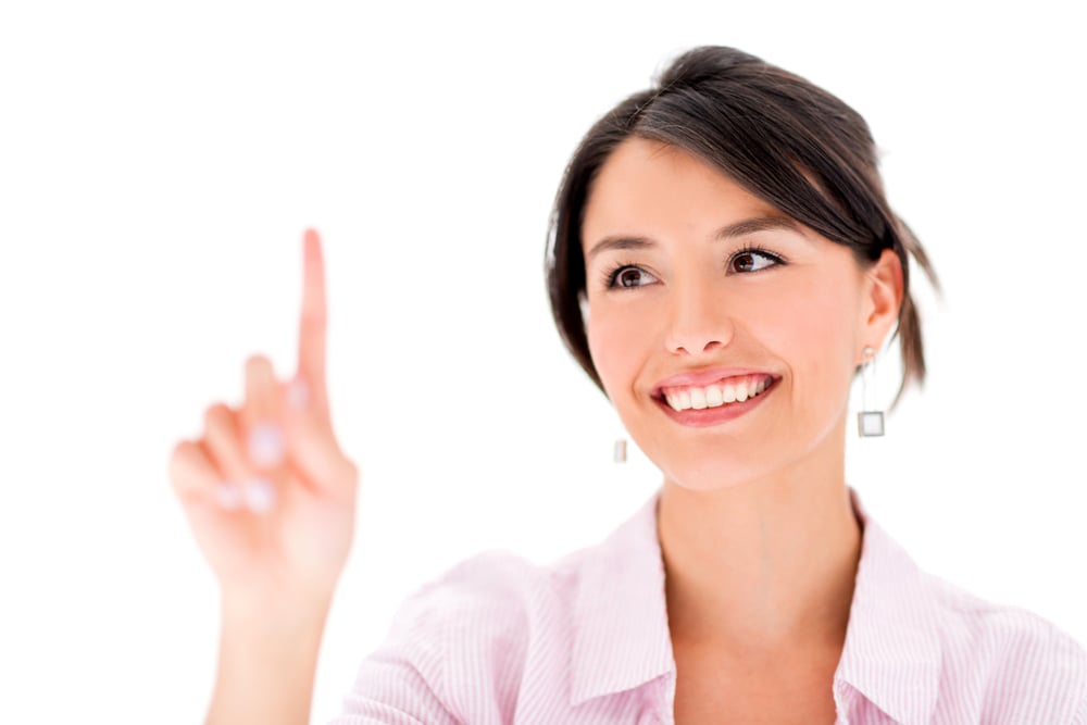 Woman touching imaginary screen with her finger - isolated over white